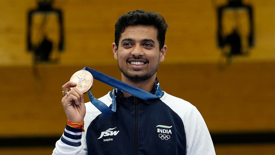India's Swapnil Kusale celebrates after winning the bronze medal in the 50m rifle 3 positions men's final at the 2024 Summer Olympics, Thursday, Aug. 1, 2024, in Chateauroux, France. - AP/Manish Swarup
